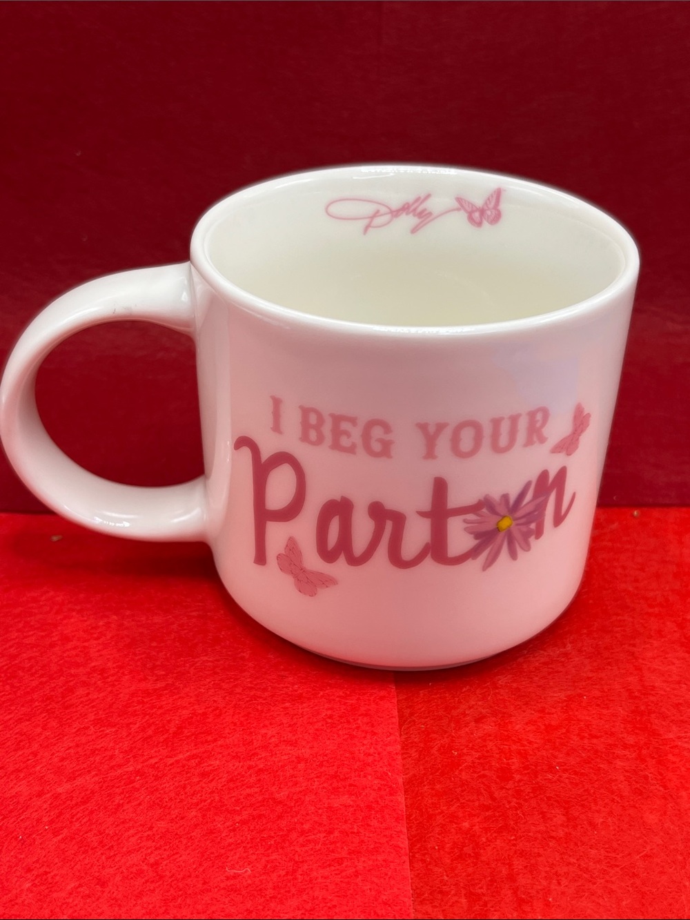 Dolly Parton White Ceramic Mug with Pink Floral 'I Beg Your Pardon' Design